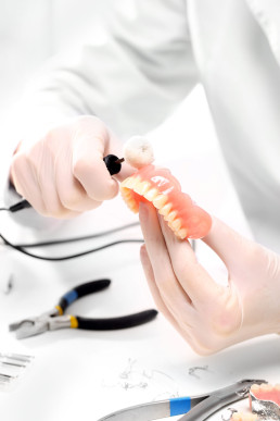 Dental,,A,Dental,Prosthesis,Polishes,.artificial,Teeth,,Prosthetics.prosthetics,Hands,While